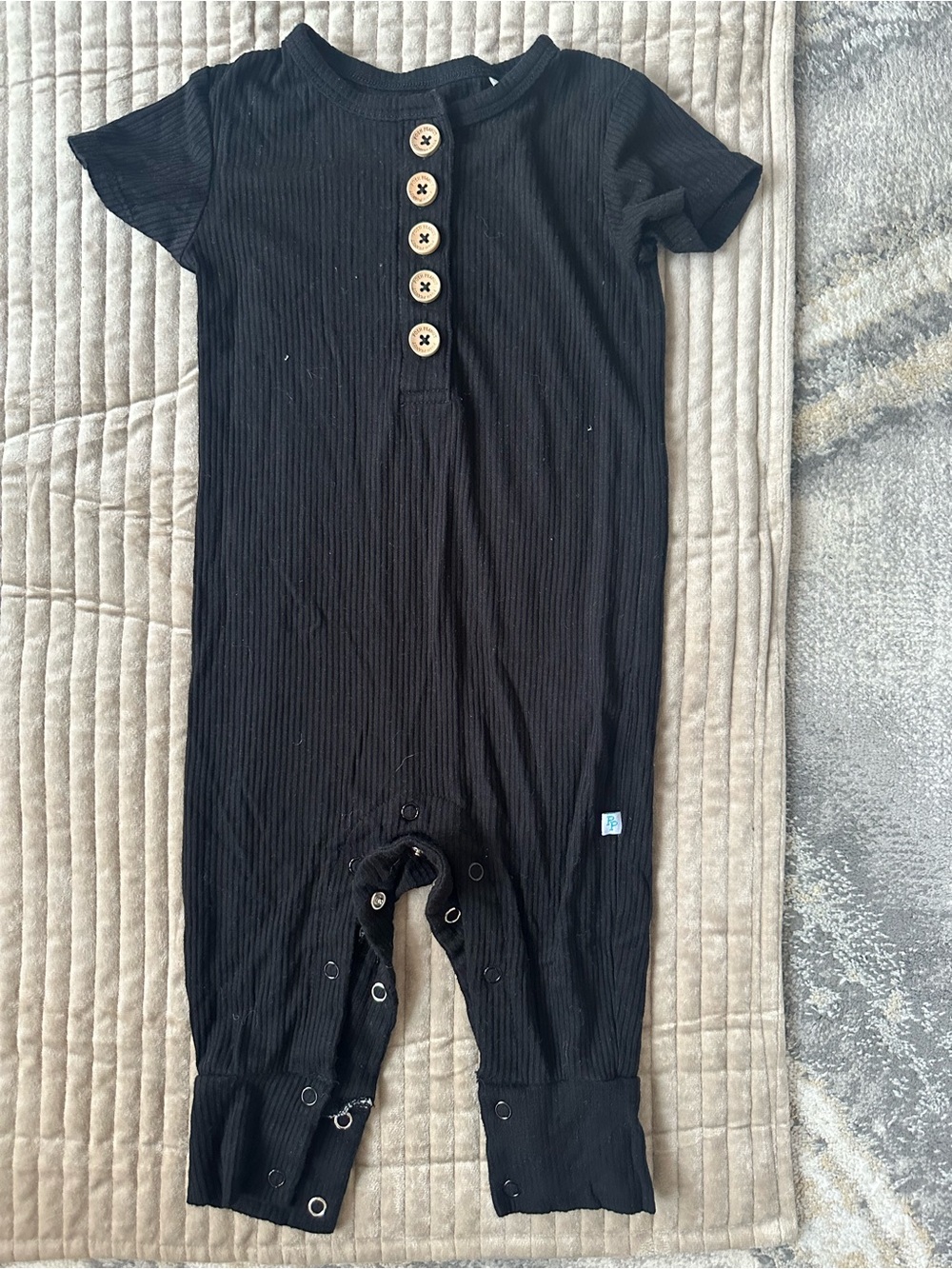 Posh Peanut Black Ribbed Short Sleeve Buttoned Romper